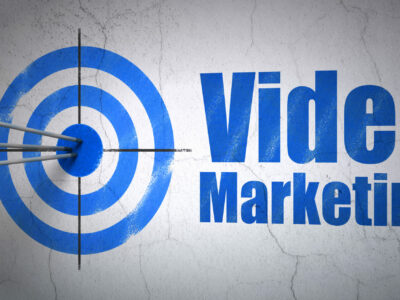 Success business concept: arrows hitting the center of target, Blue Video Marketing on wall background, 3d render